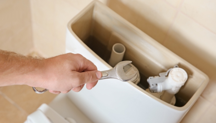 Toilet Repair With Wrench